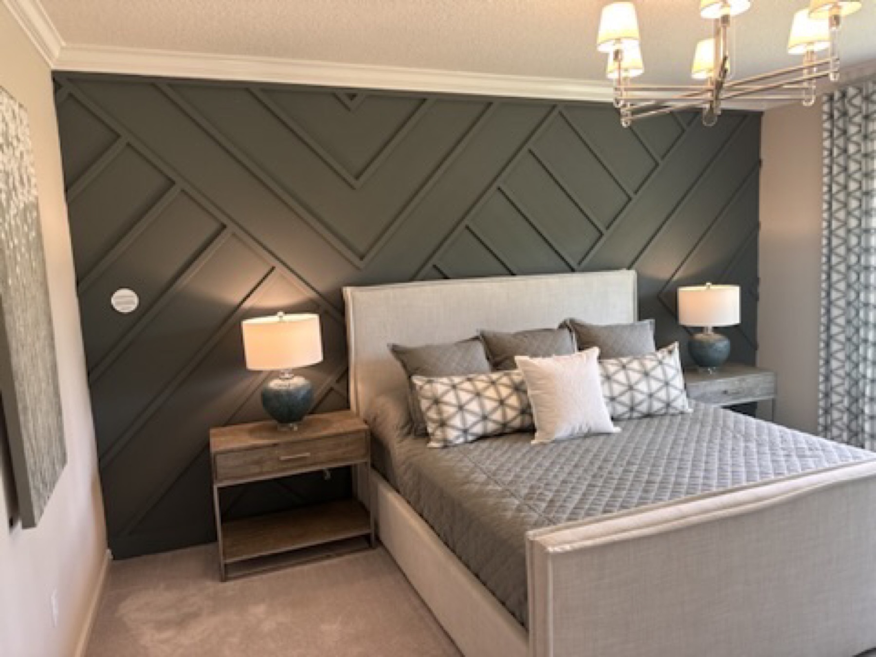 Dark geometric bedroom accent wall